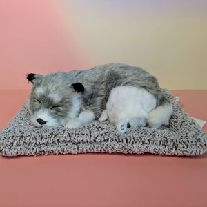 Grey And White Plush Sleeping Puppy On Cozy Bed